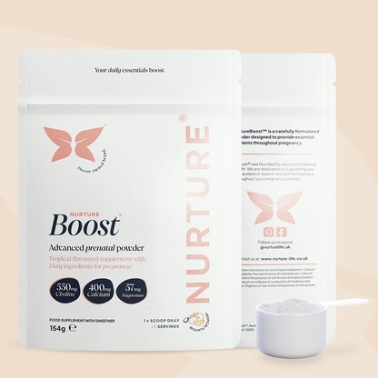 A pouch of NurtureBoost advanced prenatal powder with a measuring scoop in front, branding and information visible on the packaging.