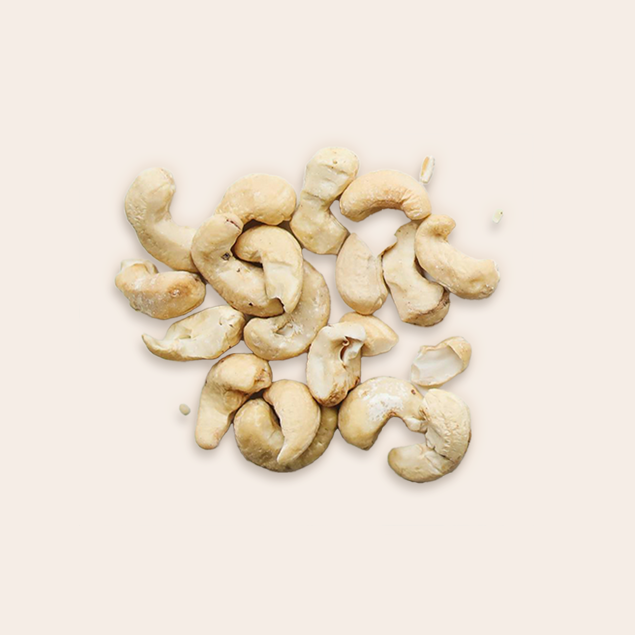 A pile of cashews on a plain background 