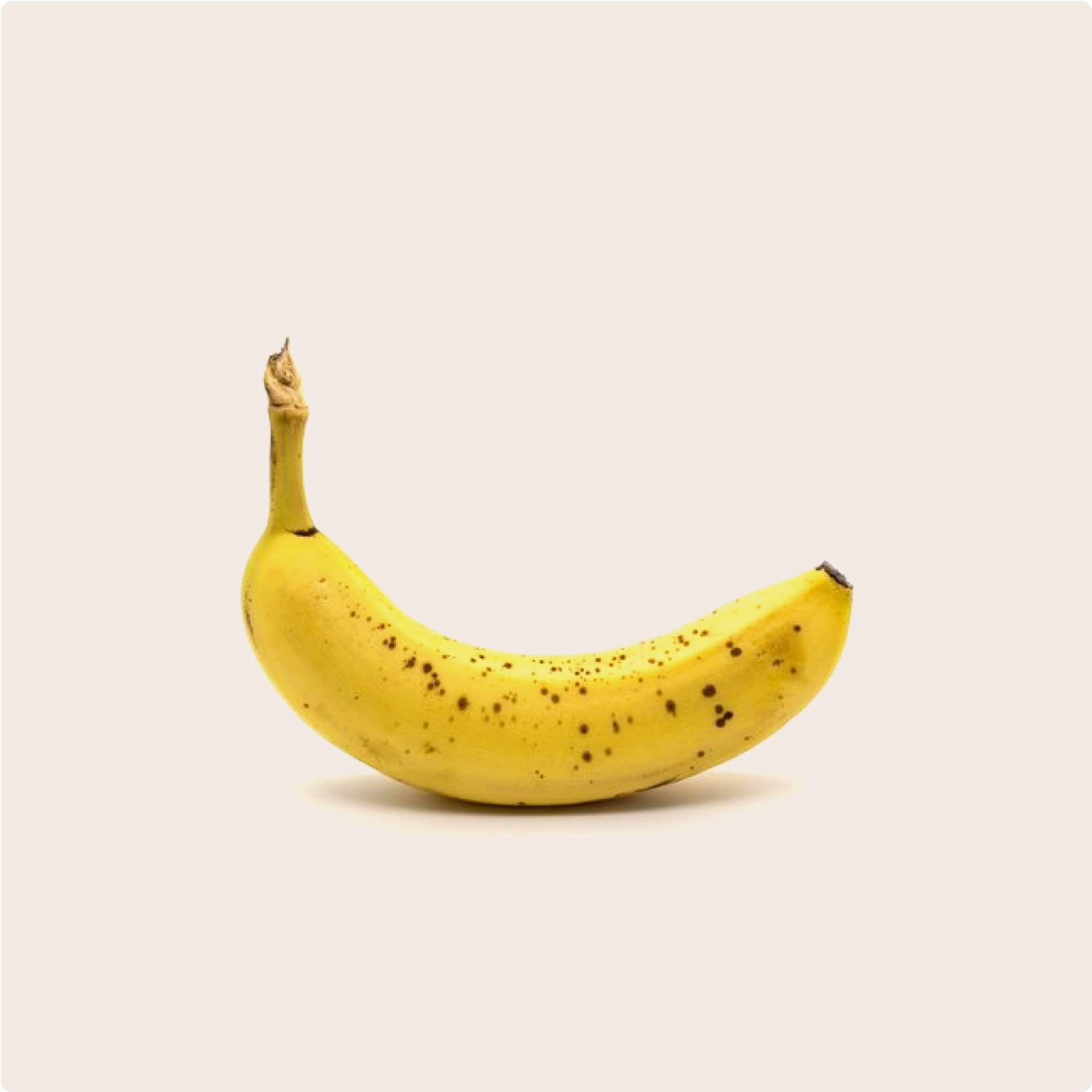 Ripe banana on a plain cream background, high in magnesium 