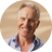 Close-up of Professor Mark Johnson smiling against a warm background. 