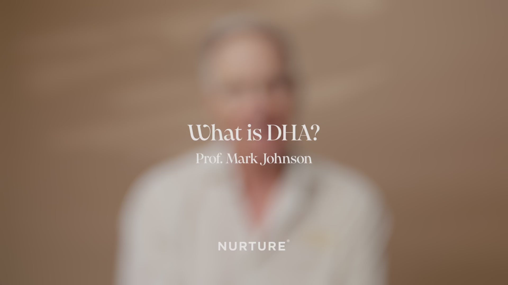 Professor Mark Johnson explaining what DHA is against a plain background 